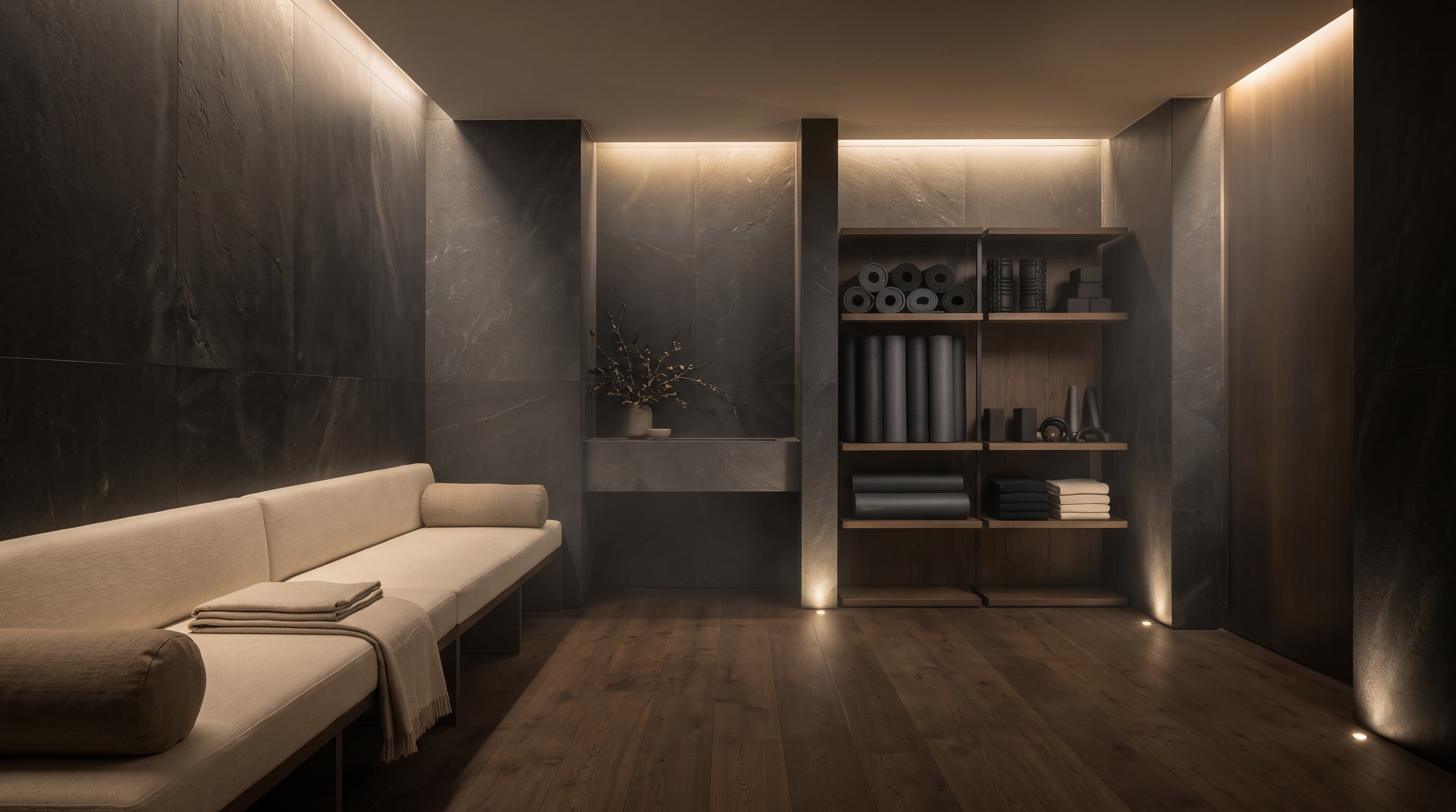 Calm recovery room with stone walls, exercise mats and warm low lighting